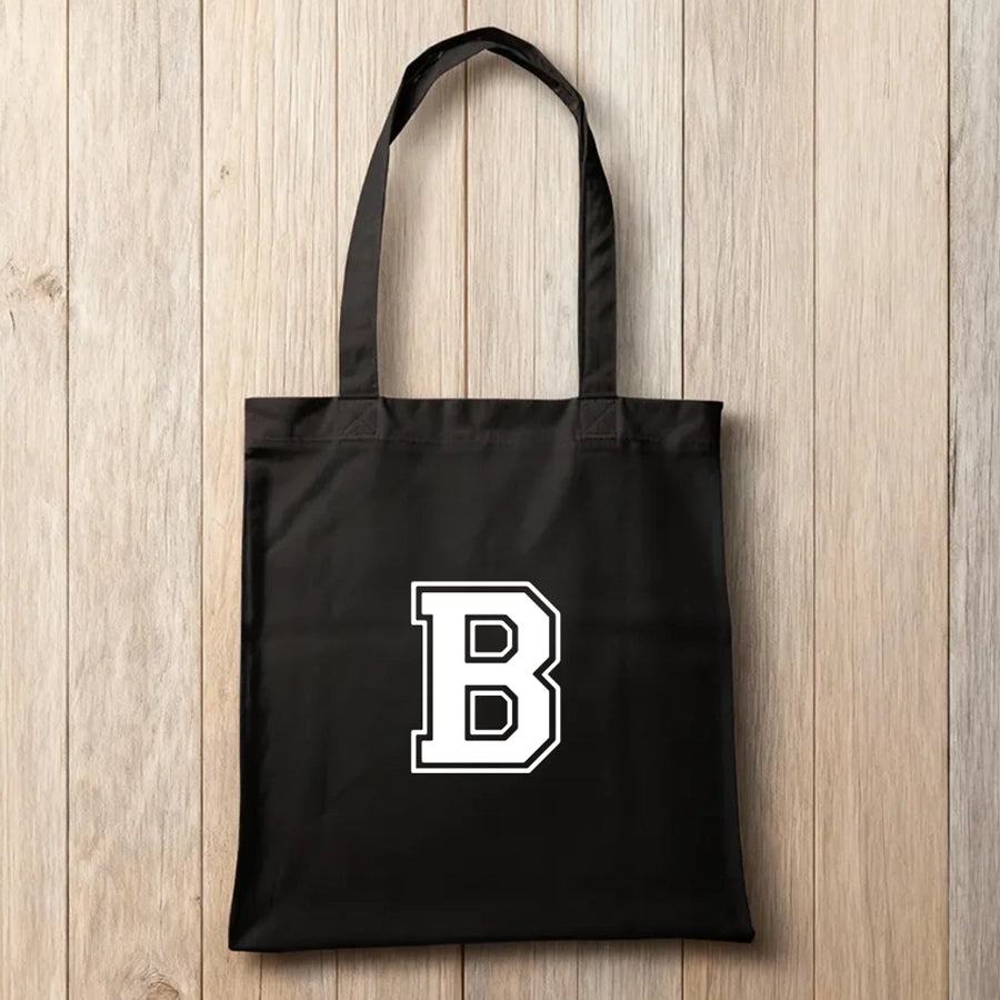 Schwarze Baumwolltasche mit individuellem sportlichen Monogramm-Aufdruck – moderne, personalisierte Stofftasche für Shopping, Freizeit und Training.