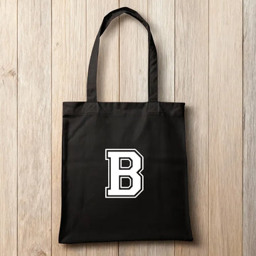 Schwarze Baumwolltasche mit individuellem sportlichen Monogramm-Aufdruck – moderne, personalisierte Stofftasche für Shopping, Freizeit und Training.